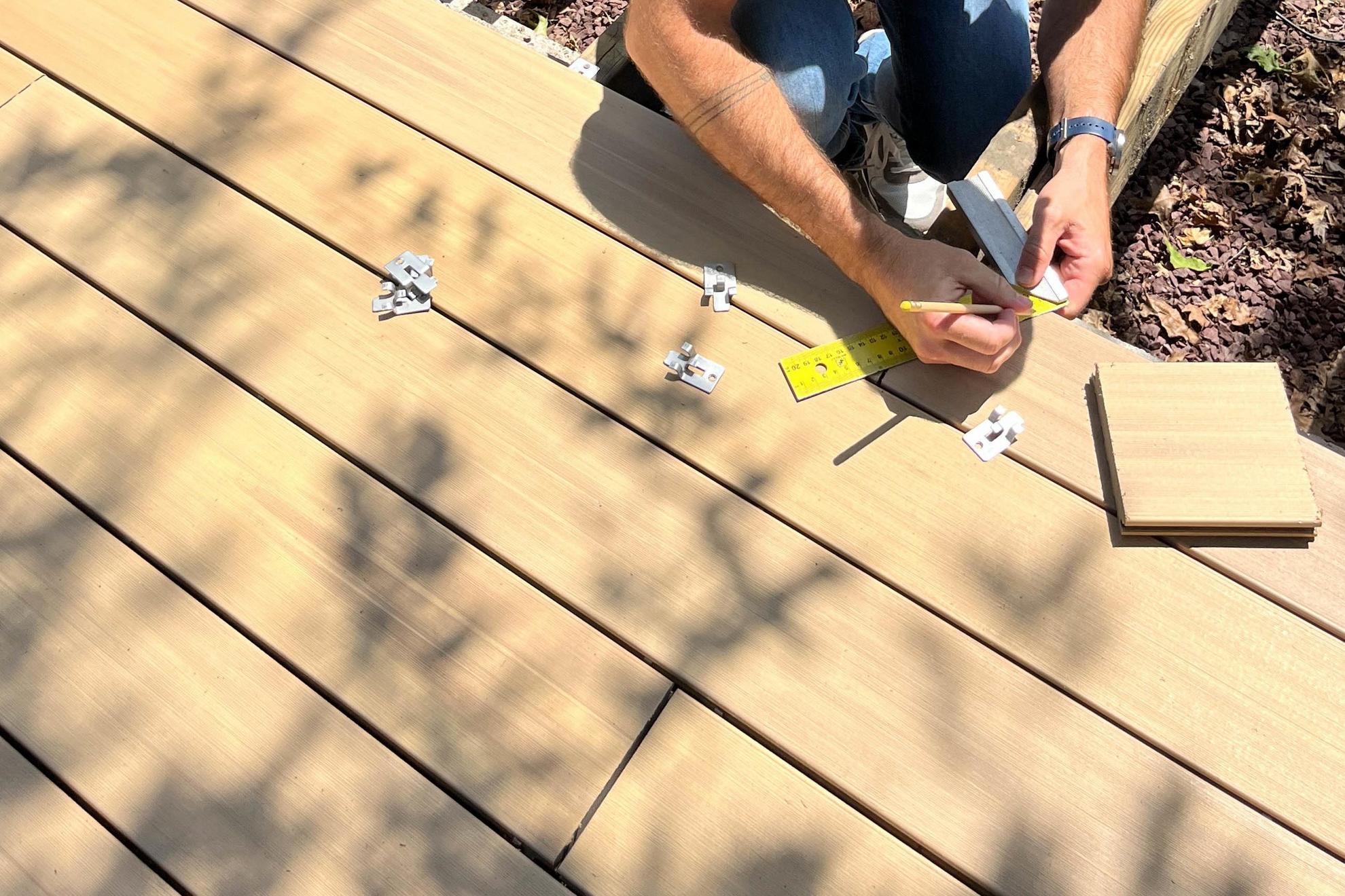 Composite decking boards installation with stainless steel clip fasteners