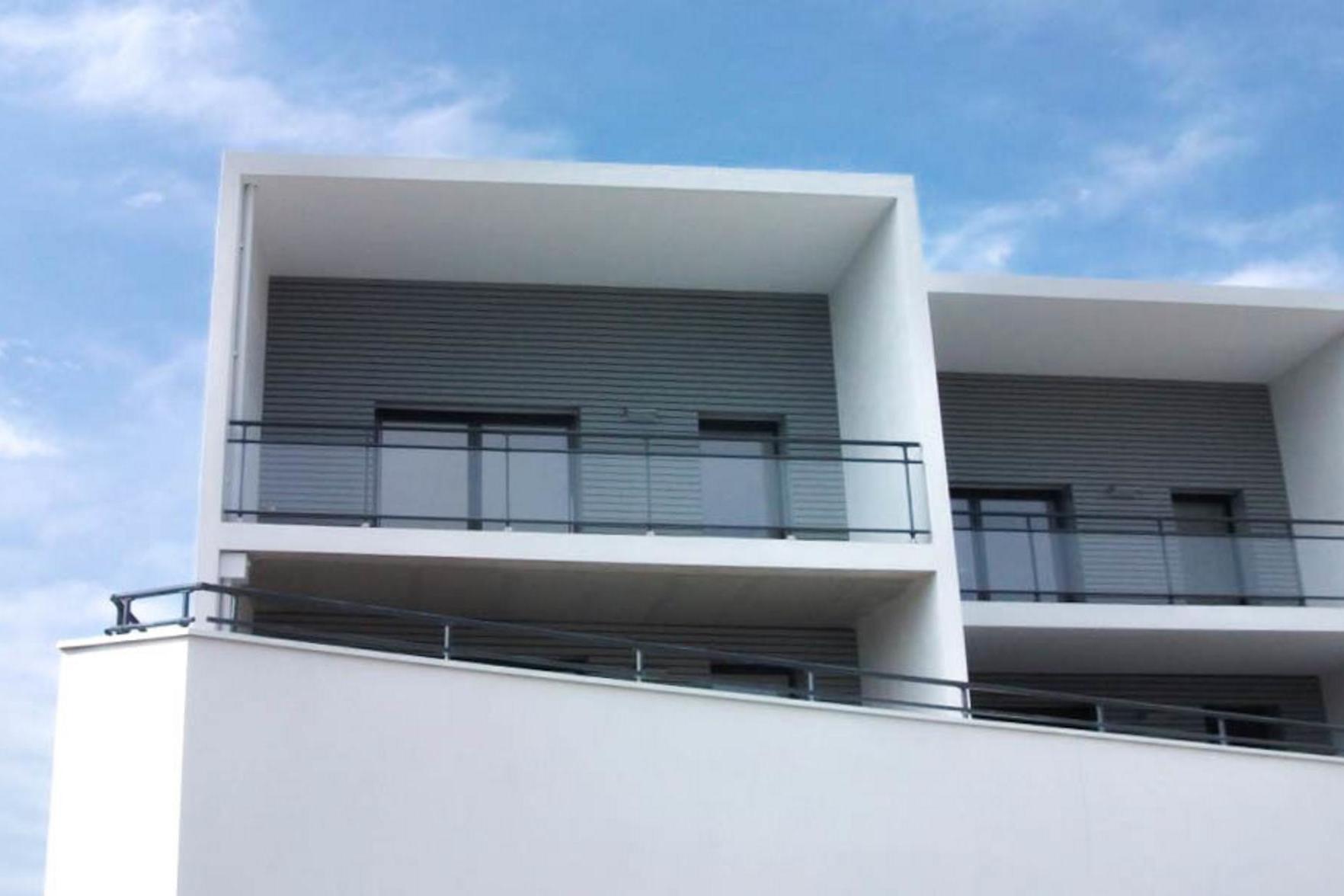 Grey composite cladding on apartment building in La Rochelle